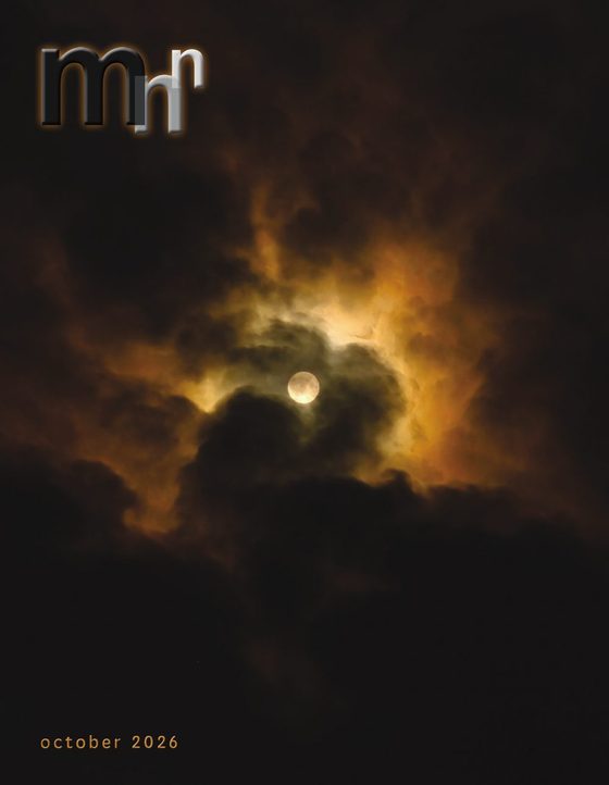 October 2026 cover: the full moon through dark orange-lit clouds
